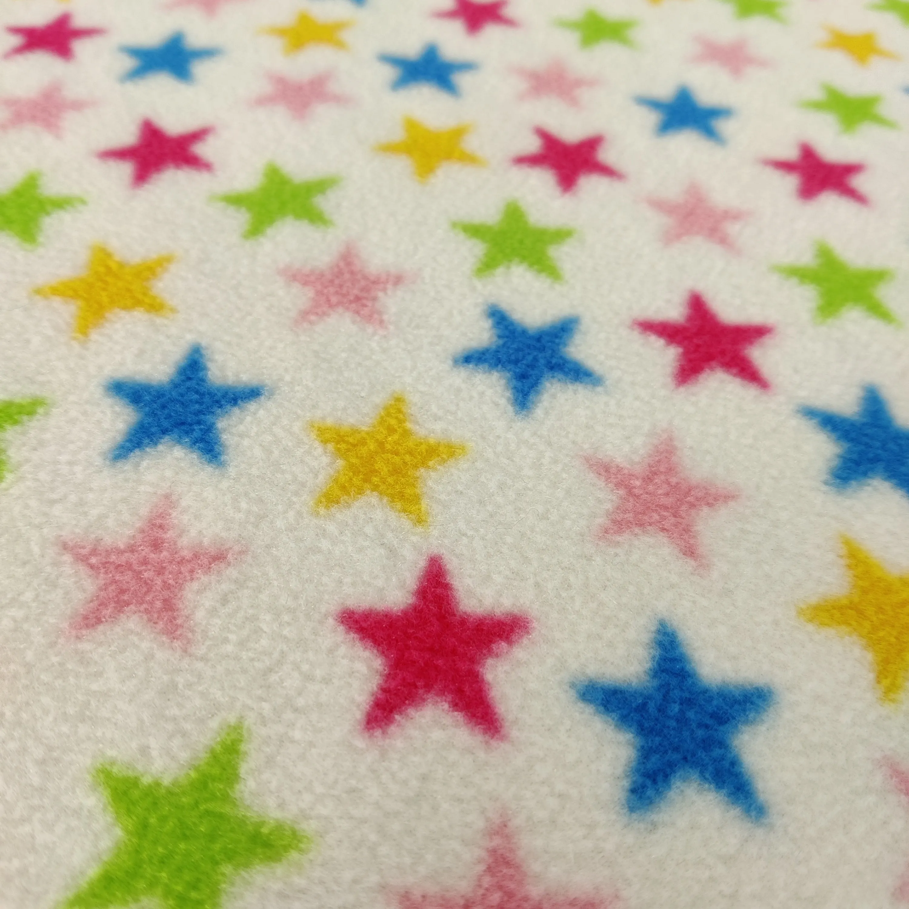 FS743_1 Multicolour Stars Fleece Fabric White