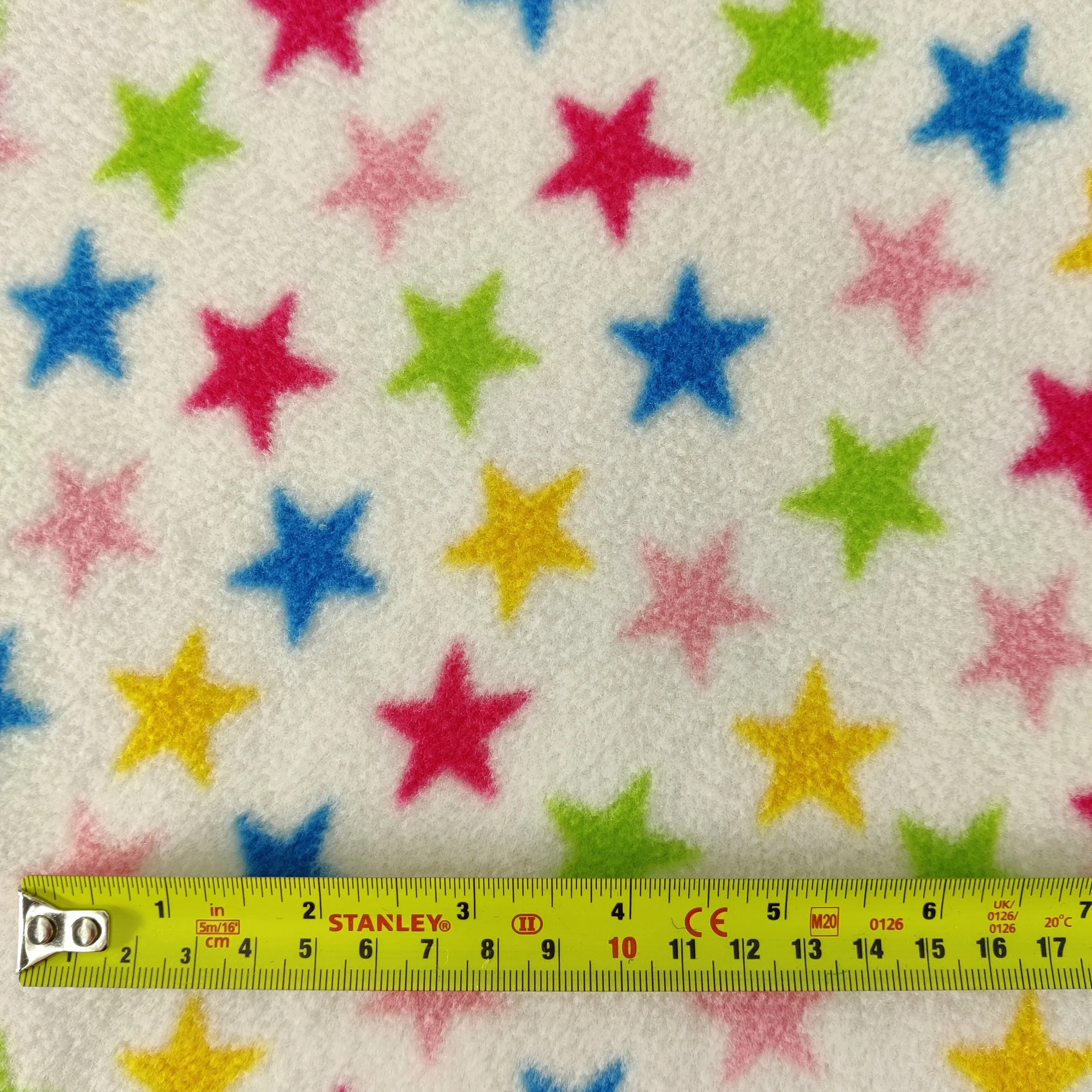 FS743_1 Multicolour Stars Fleece Fabric White